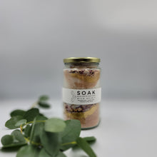 Load image into Gallery viewer, Magnesium Salt Soak with Rose Petals, Gold Mica and French Pink Clay. Product Front Feature Detail with Sprig of Eucalyptus 
