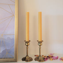 Load image into Gallery viewer, Bees Wax Taper Candles in brass Candle Holders with Flower Petals
